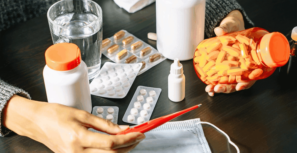 A person holds a bottle of allergy pills in one hand and a pen in the other, suggesting medication options.