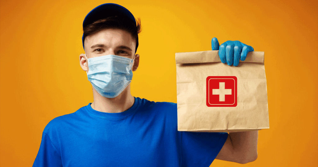 A man wearing a blue shirt and gloves is holding a paper bag with a medical symbol, suggesting a health-related item.