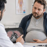 Gaucher disease patient consulting doctor about symptoms and treatment.