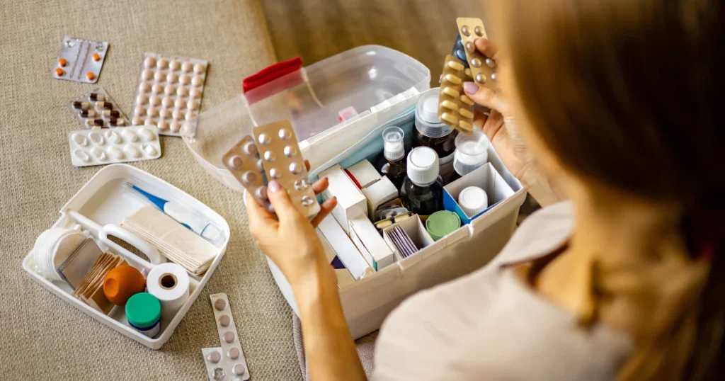 Woman placing pills in a medication lockbox